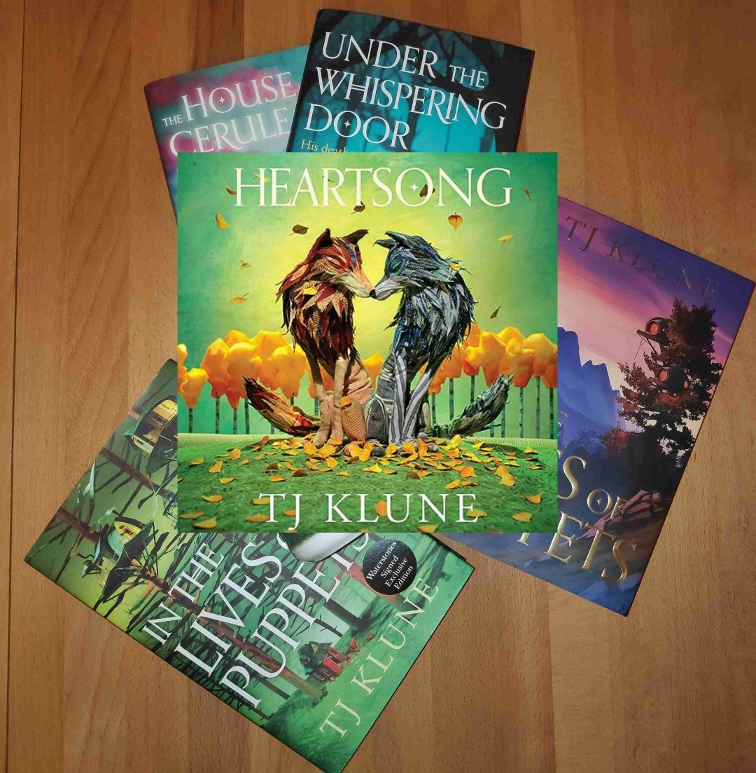 Don't get fooled by the books in the background. Heartsong is nothing like TJ Klune's other books. I mean, okay there is found family, and lots of heart and heartbreak, and crying and laughing...but other than that...
TJ Klune makes me feel all the feels, and even though this Green Creek series took a bit longer, it still did the trick. Book 3 is Robbie's story, and then though I didn't think I would care for him - I really did. The start was confusing, but once you figure out what is going on, you're all in I promise. From that point it's all pack.pack.pack.