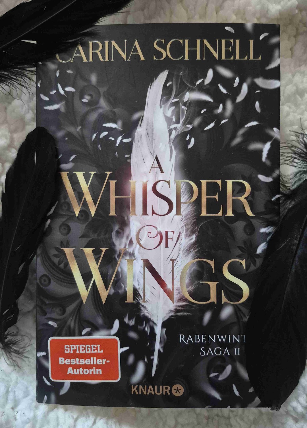 "A Whisper of Wings" von Carina Schnell - ein würdiger Abschluss der Rabenwinter Saga.